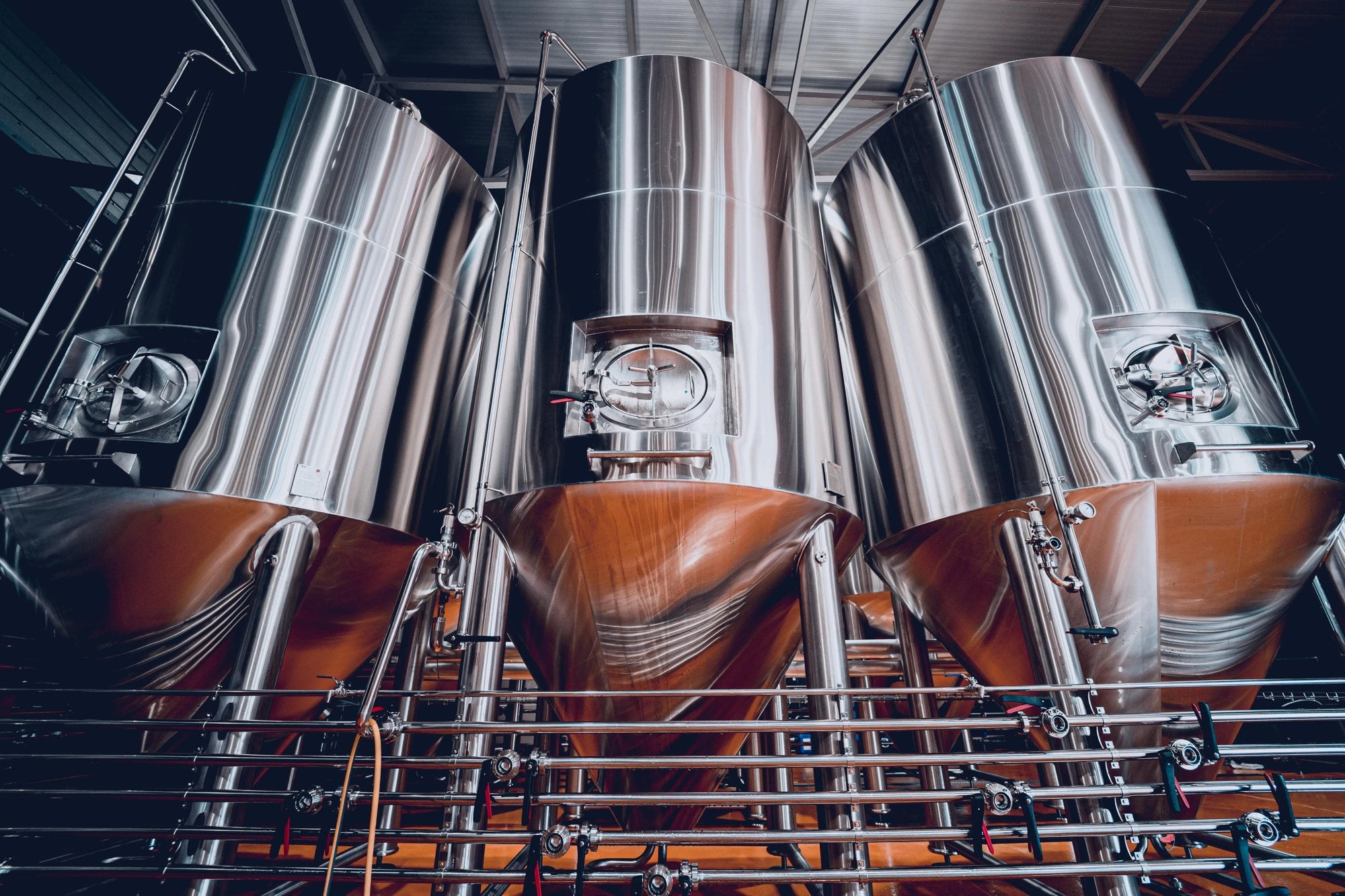 Stainless steel fermentation tanks in a brewery